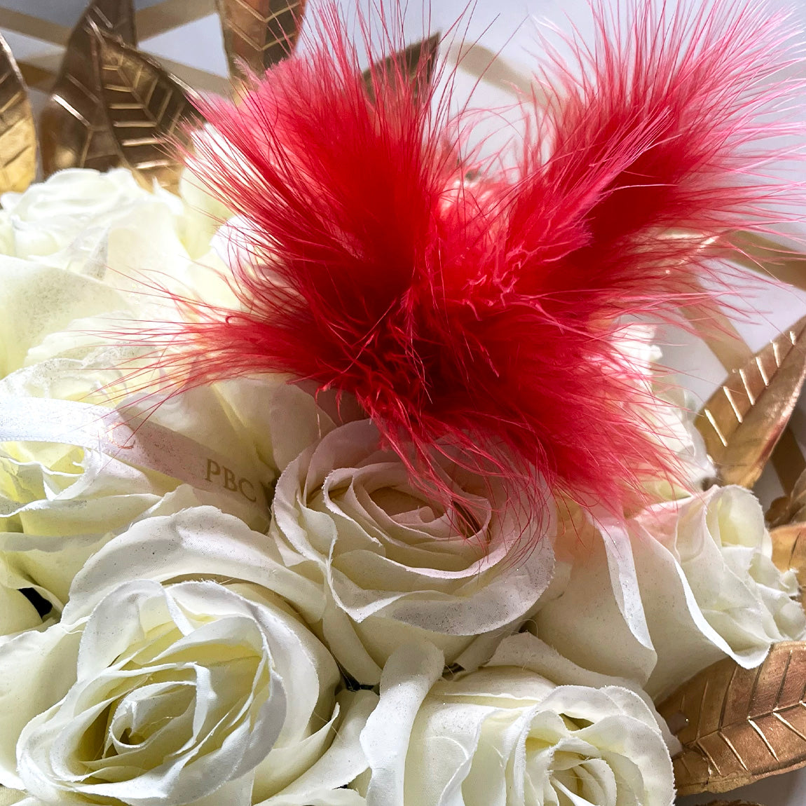 Red Feather on white flowers